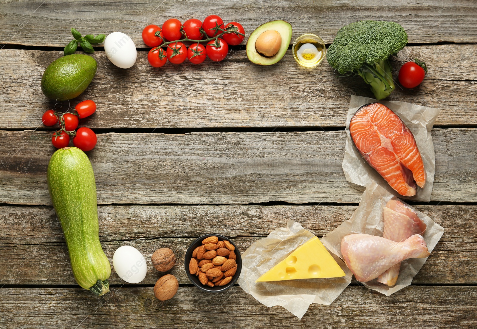 Photo of Frame of keto diet products on wooden table, space for text