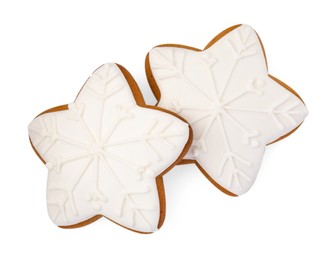 Photo of Tasty star shaped Christmas cookies with icing isolated on white, top view