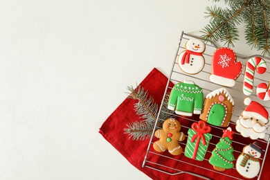 Flat lay composition with delicious homemade Christmas cookies on white table. Space for text