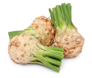 Photo of Fresh raw celery roots isolated on white