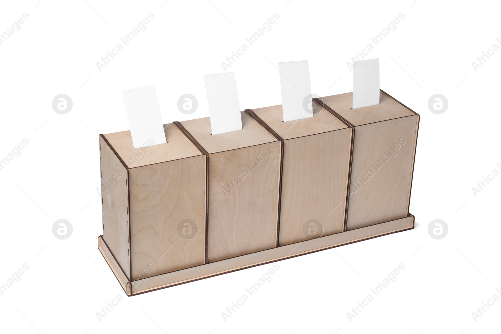 Photo of Wooden ballot boxes with votes isolated on white