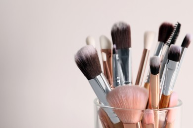 Photo of Set of professional brushes on white background, closeup. Space for text