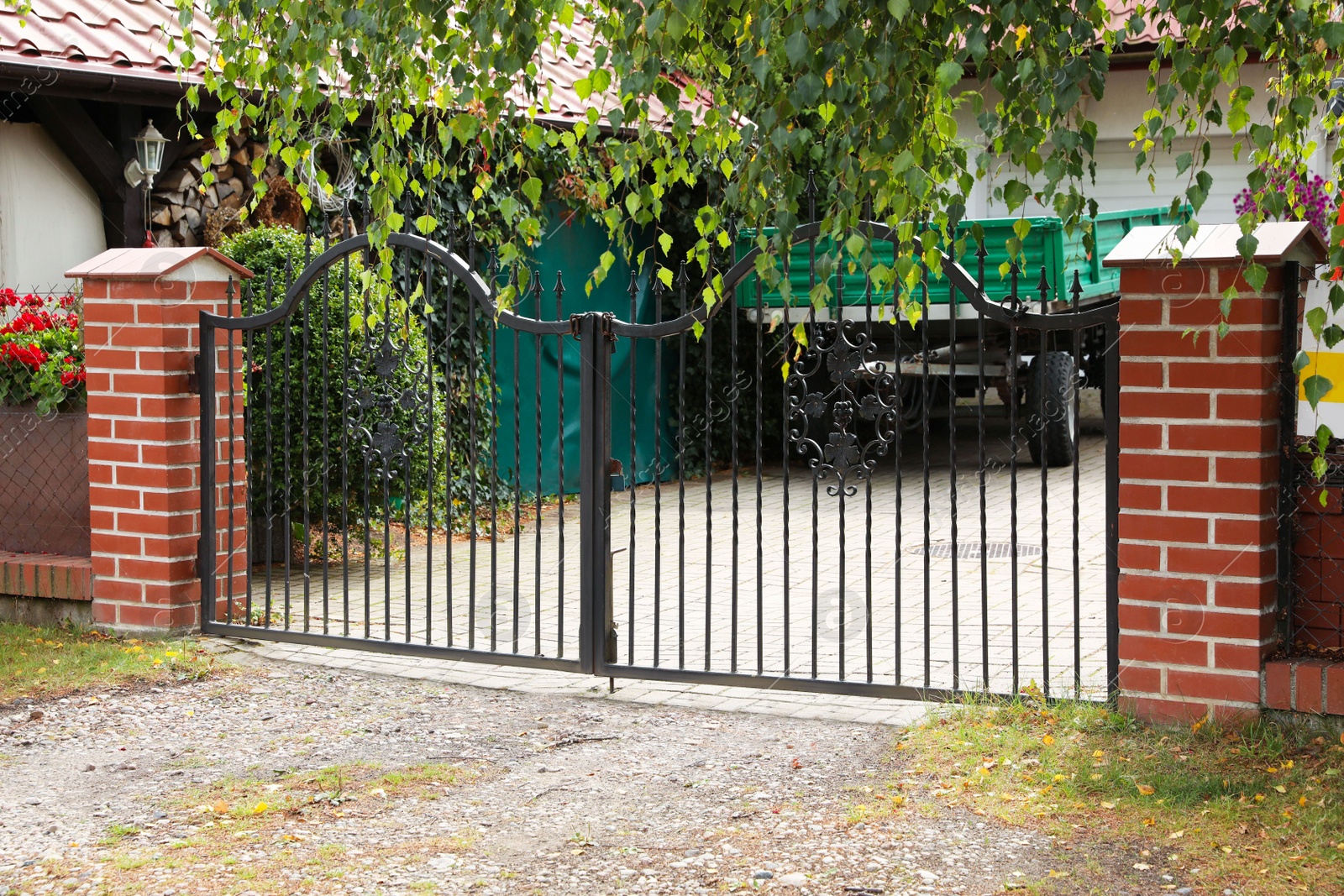 Photo of Black metal gates near private house on street