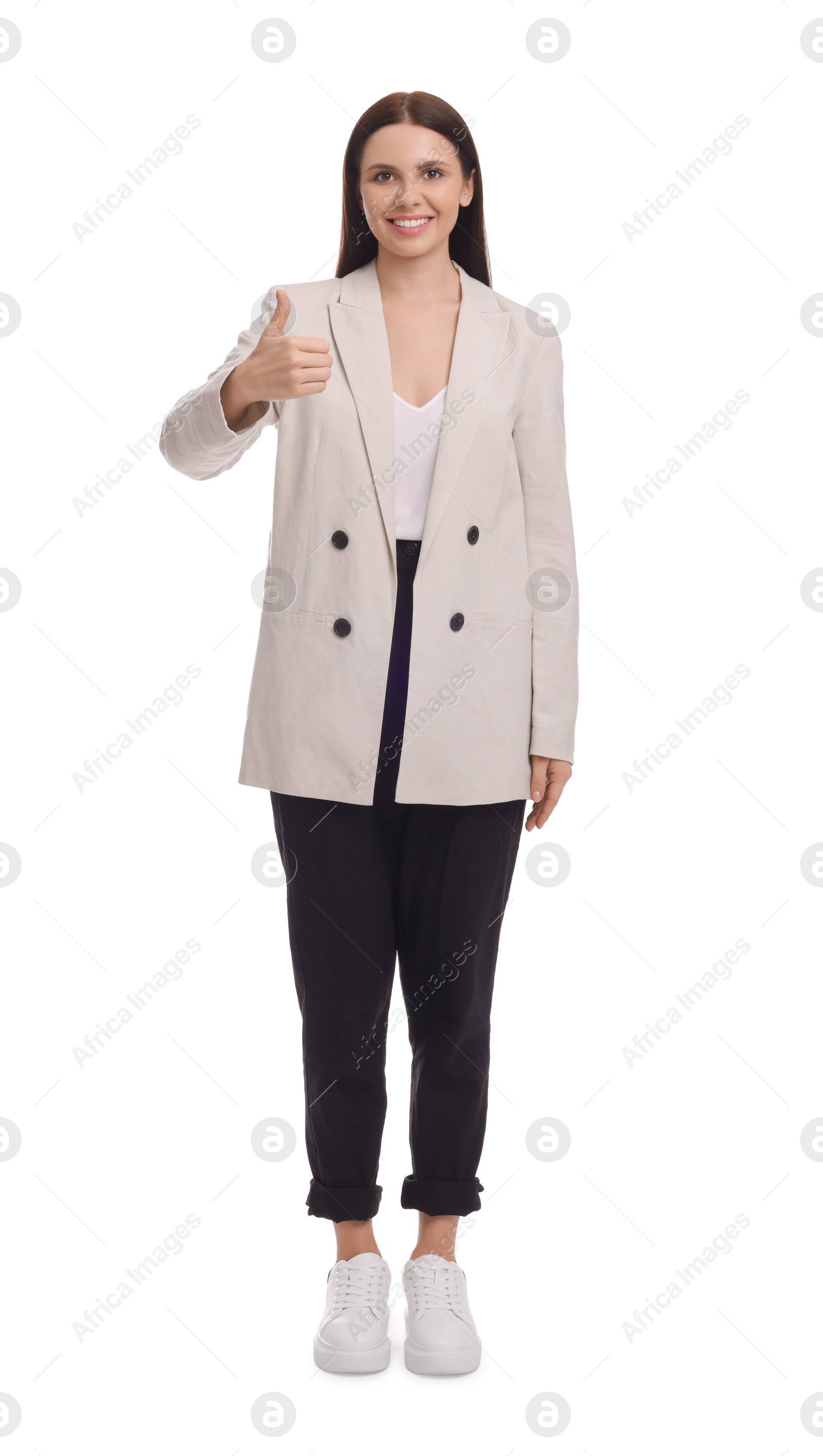 Photo of Beautiful businesswoman in suit showing thumbs up on white background