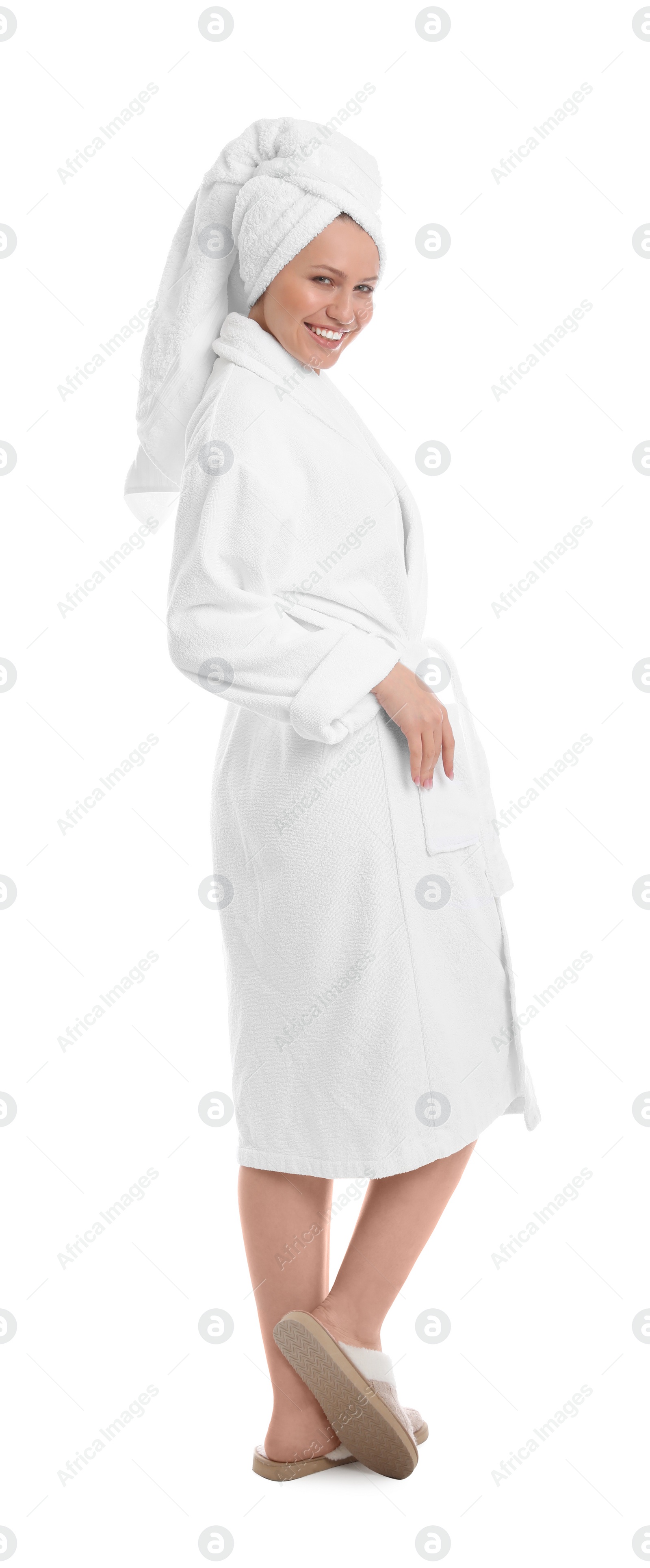 Photo of Young woman in bathrobe on white background