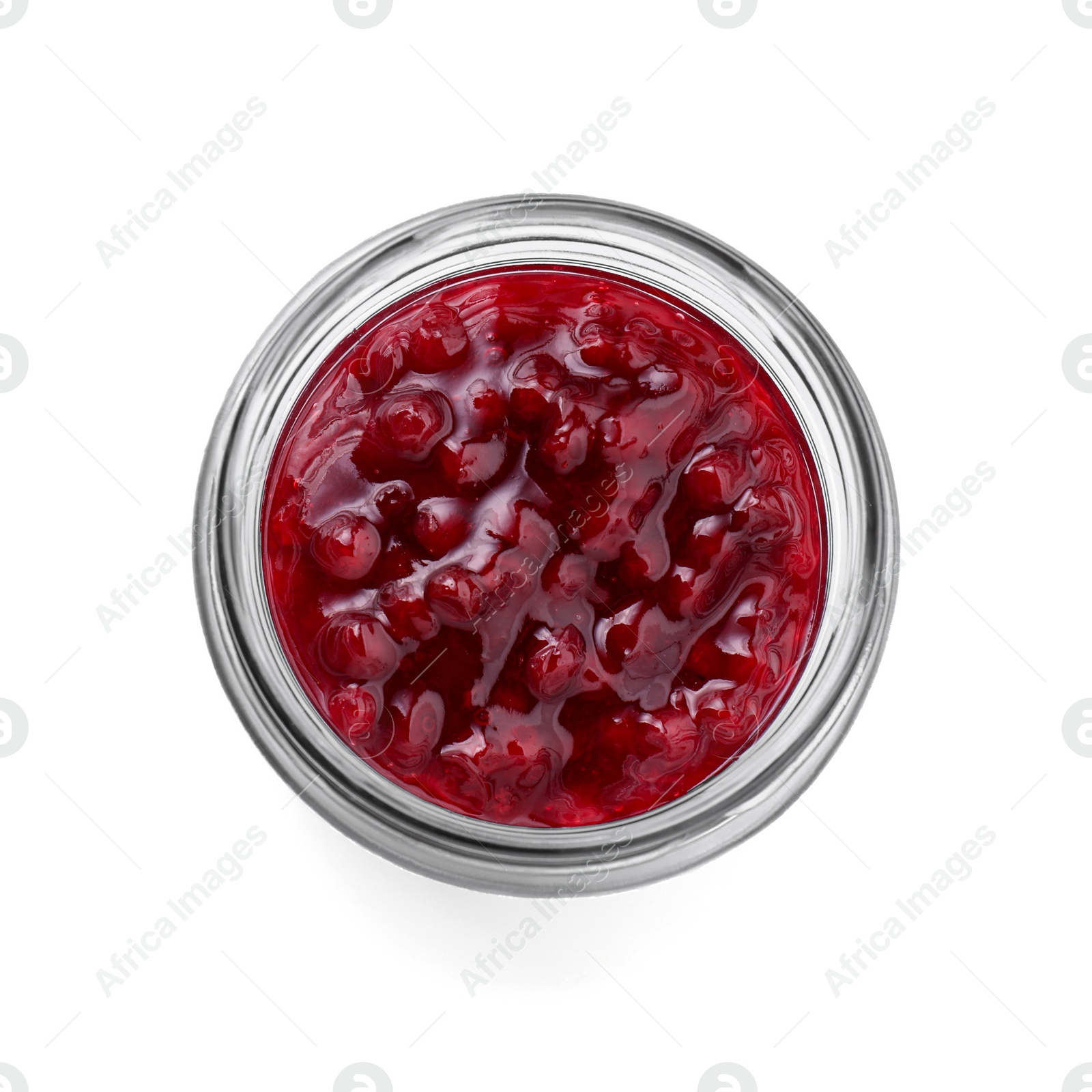 Photo of Fresh cranberry sauce in glass jar isolated on white, top view