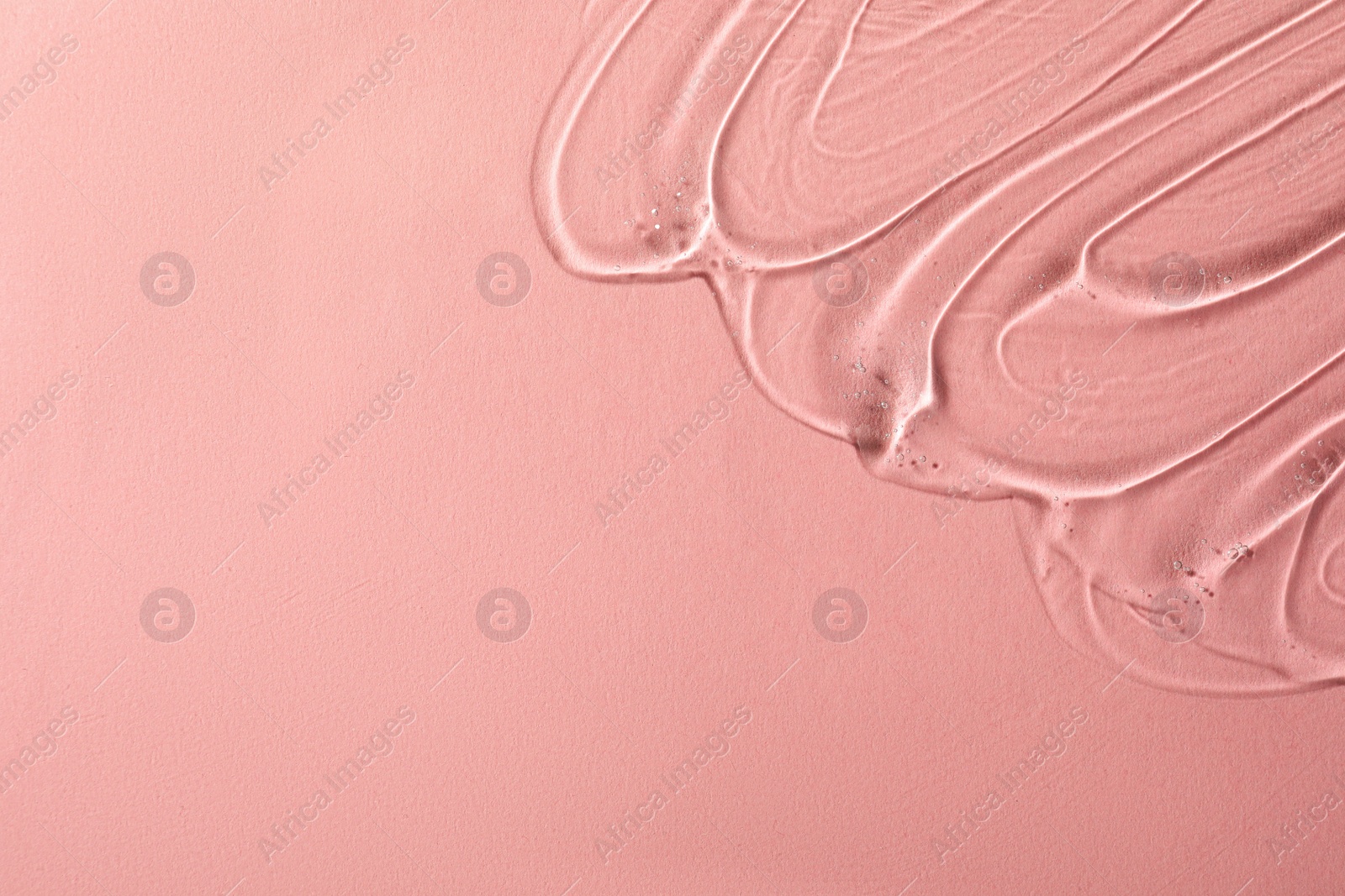 Photo of Cosmetic gel on pink background, top view. Space for text