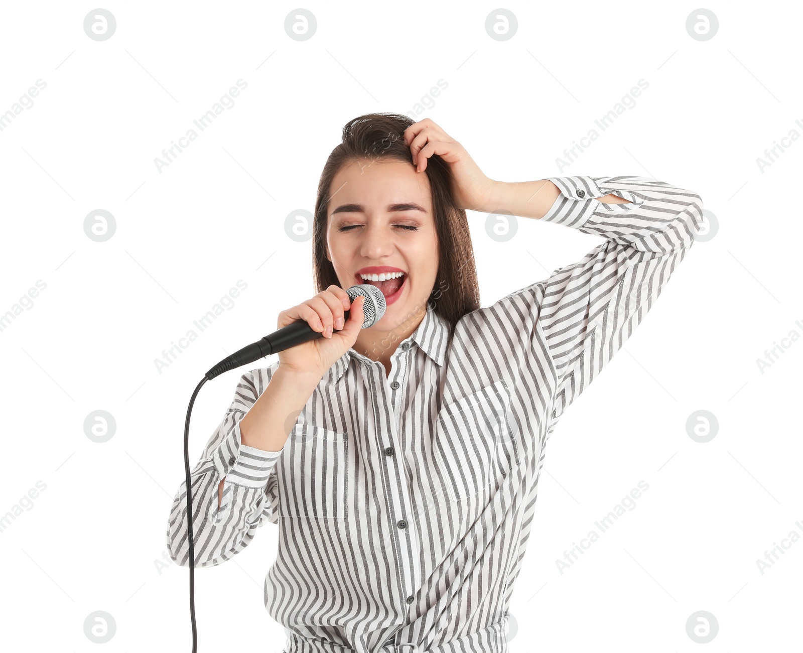 Photo of Young woman wearing casual clothes singing in microphone on white background