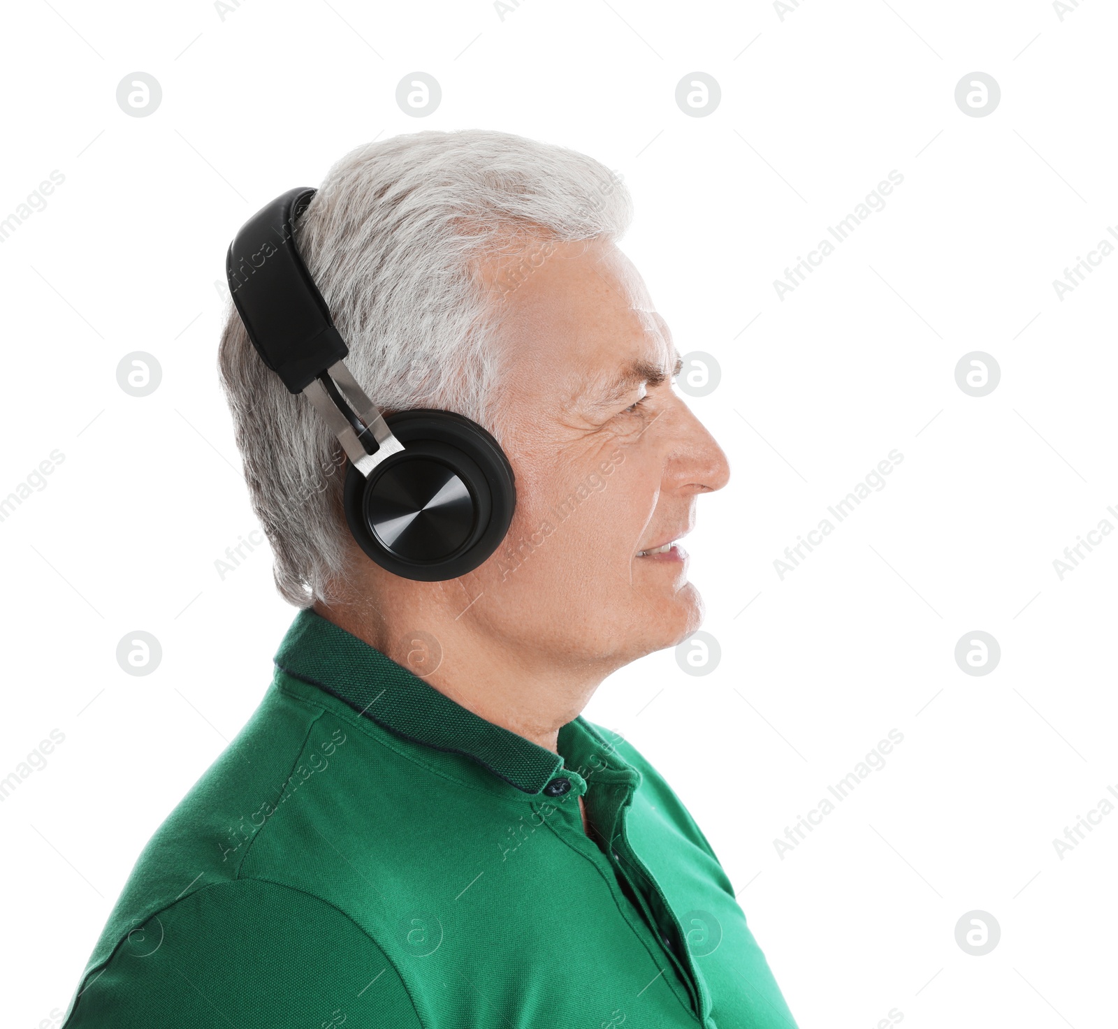 Photo of Mature man enjoying music in headphones on white background