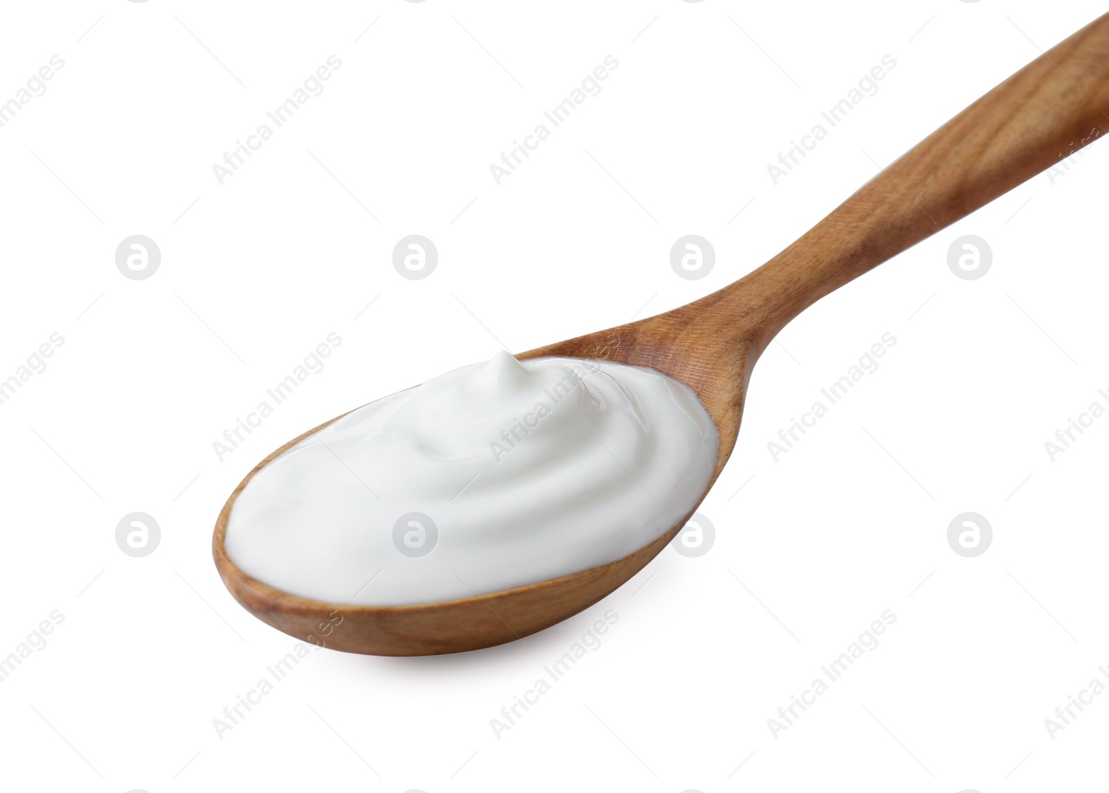 Photo of One wooden spoon with sour cream isolated on white