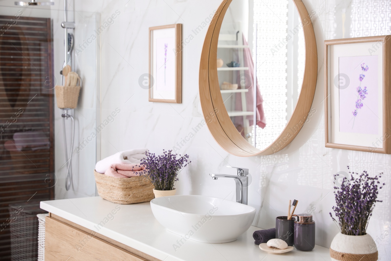 Photo of Mirror and counter with vessel sink in bathroom interior. Idea for design