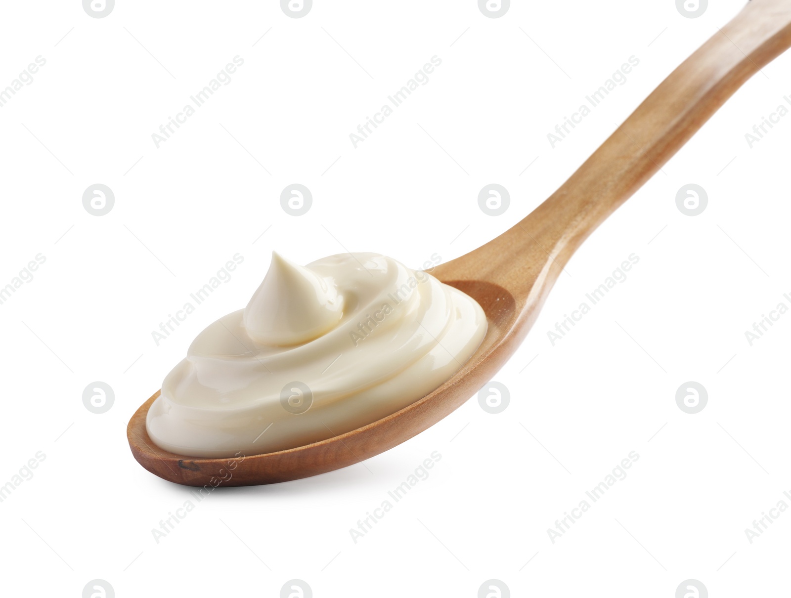 Photo of Natural yogurt in wooden spoon isolated on white