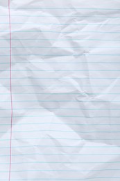 Photo of Crumpled lined notebook sheet as background, top view