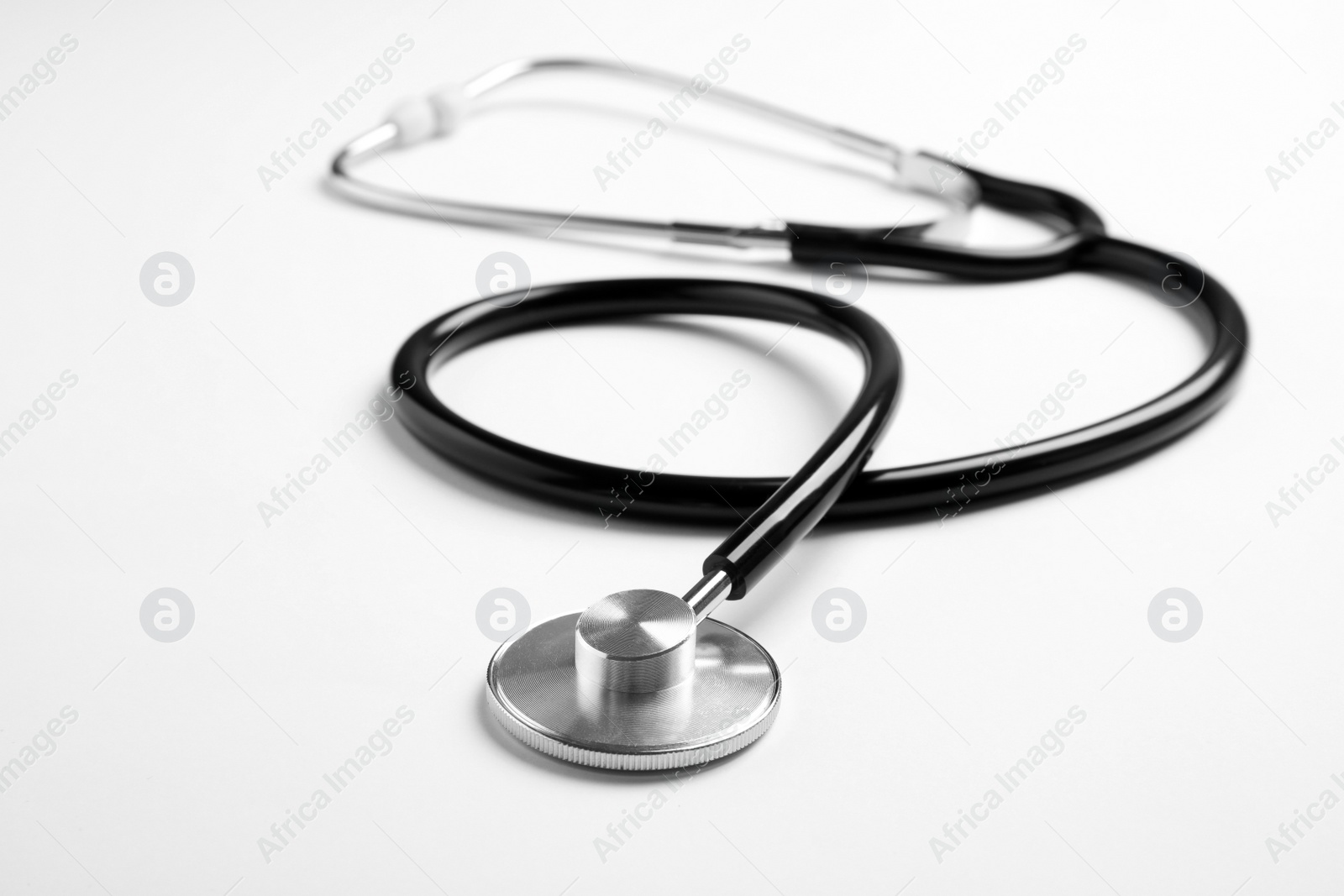 Photo of Modern stethoscope isolated on white. Medical tool