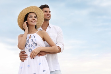 Photo of Lovely couple spending time together outdoors. Space for text