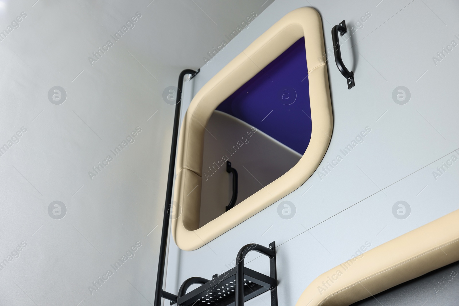 Photo of Capsule in modern pod hostel, low angle view