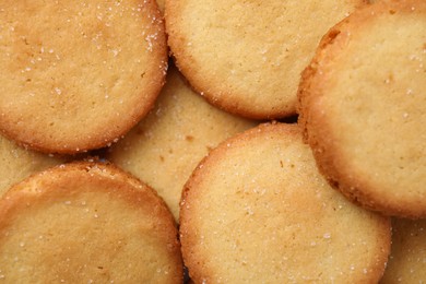 Photo of Tasty sweet sugar cookies as background, top view