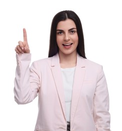 Photo of Beautiful businesswoman pointing at something on white background