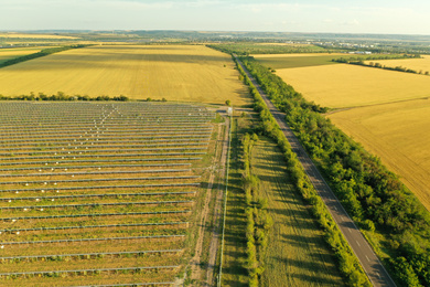 Solar panels installed outdoors, aerial view. Alternative energy source