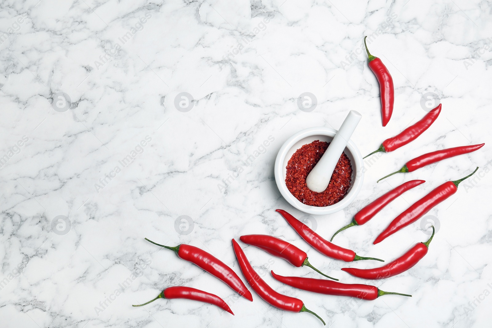 Photo of Flat lay composition with chili peppers on marble background