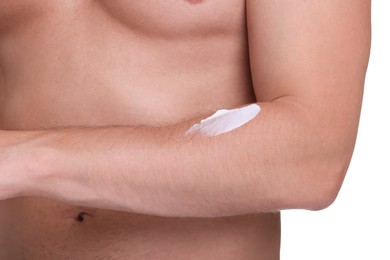 Photo of Man with sun protection cream on his arm against white background, closeup