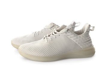 Photo of Pairstylish sneakers on white background