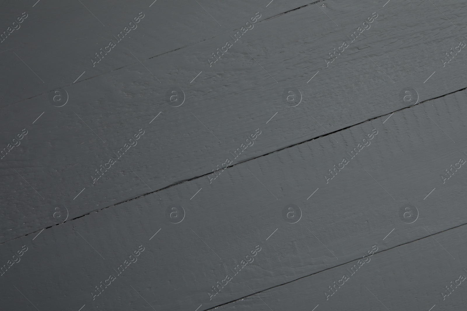 Photo of Texture of black wooden surface as background, closeup