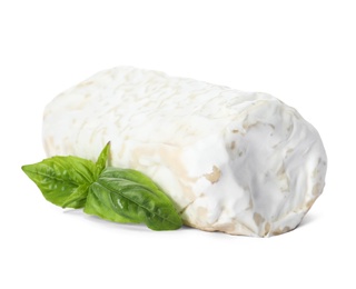 Photo of Delicious fresh goat cheese with basil on white background
