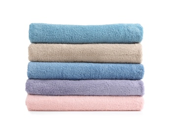 Photo of Stack of clean soft towels on white background