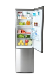 Photo of Open refrigerator with many different products on white background