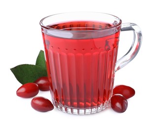 Photo of Glass cup of fresh dogwood tea, berries and leaves on white background