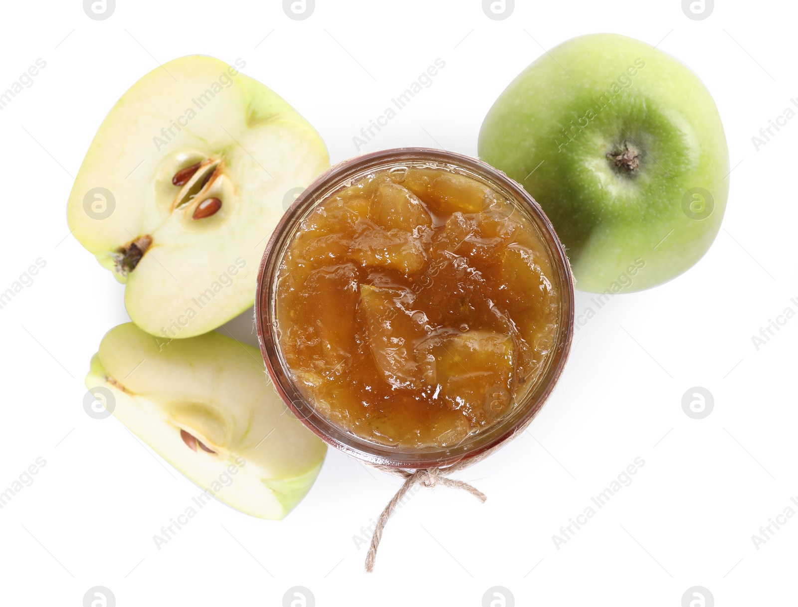 Photo of Glass jar of delicious apple jam and fresh fruits isolated on white, top view