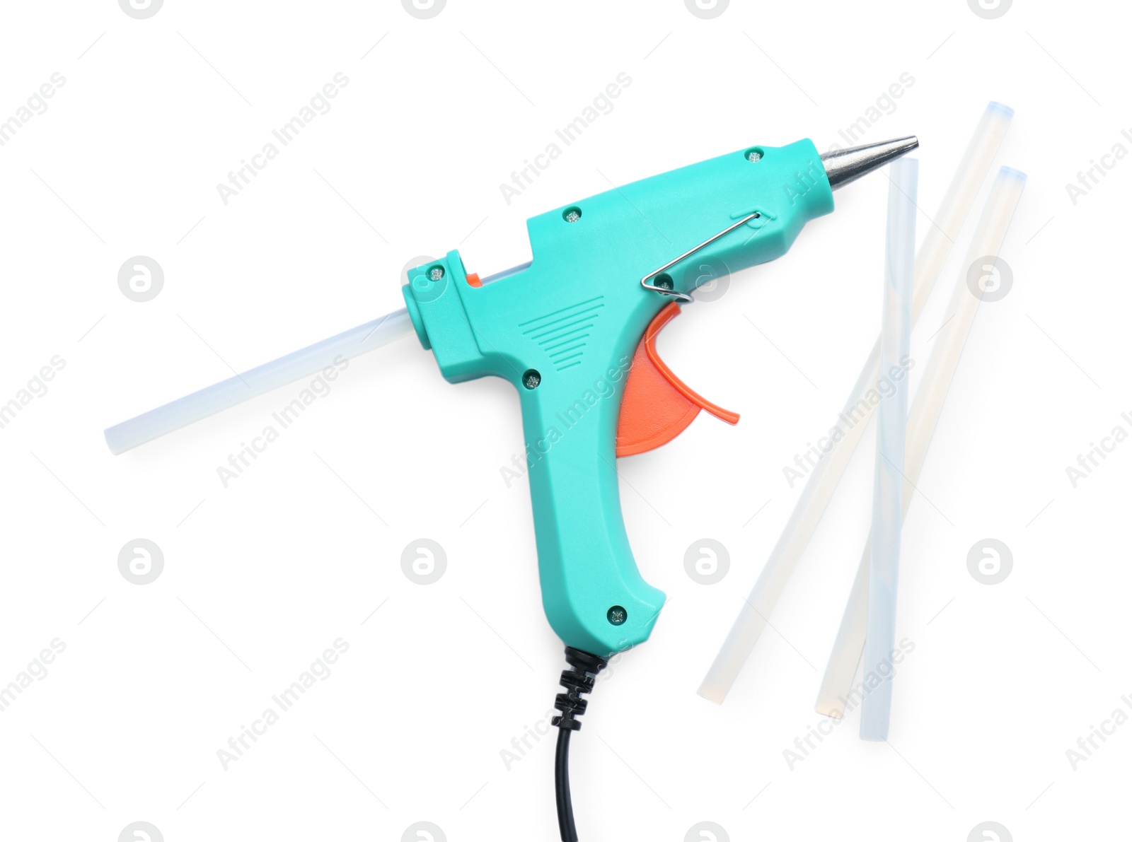 Photo of Turquoise glue gun and sticks on white background, top view