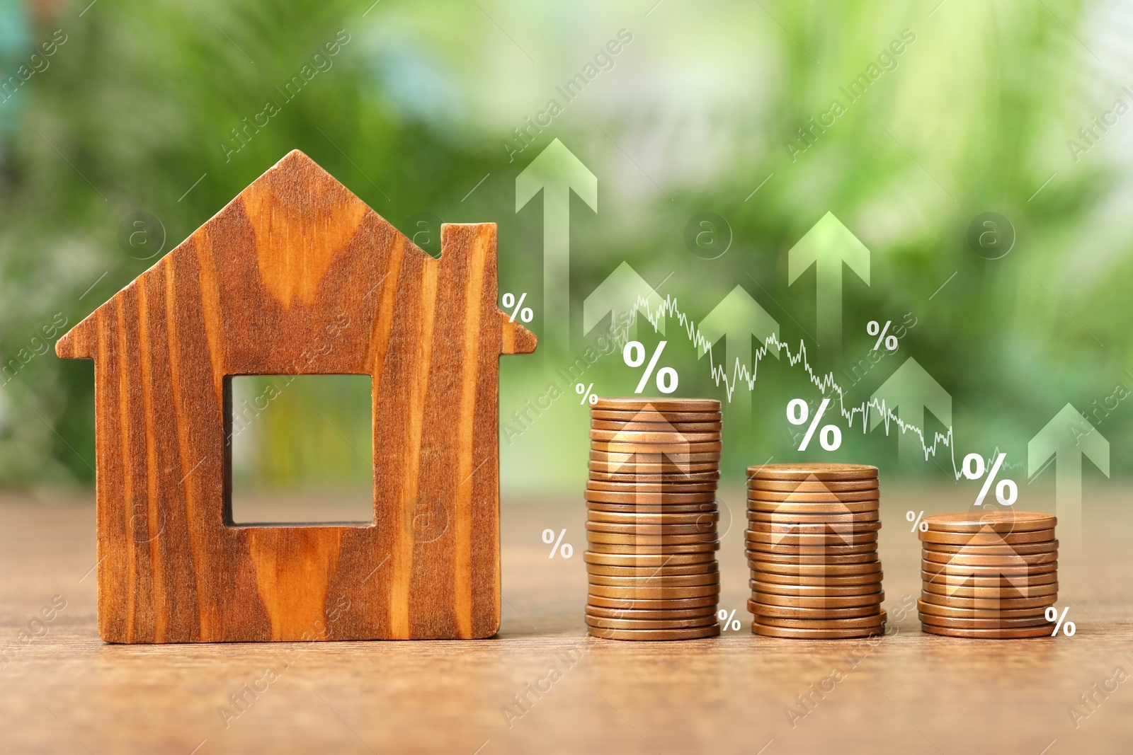 Image of Mortgage rate. Model of house, stacked coins, graph, percent signs and upward arrows