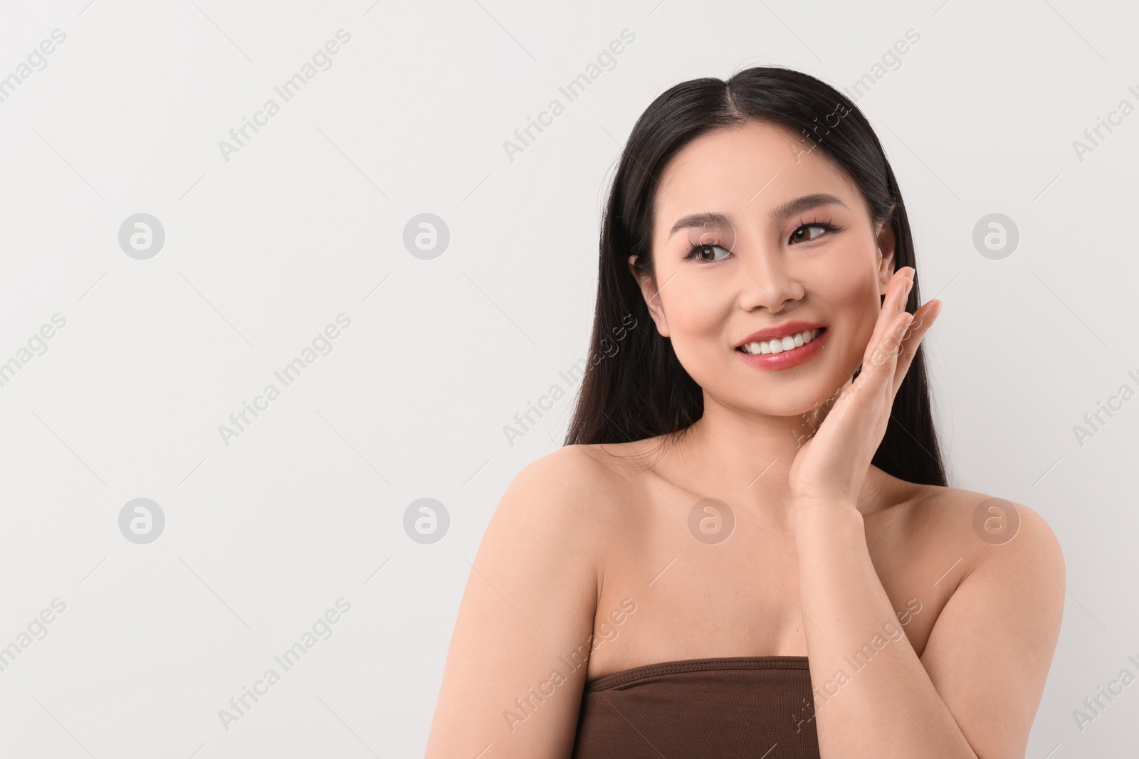 Photo of Portrait of beautiful woman on white background