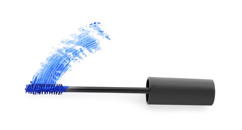 Applicator brush and blue mascara stroke on white background, top view