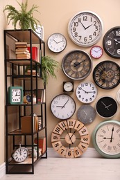 Photo of Stylish room interior with collection of wall clocks