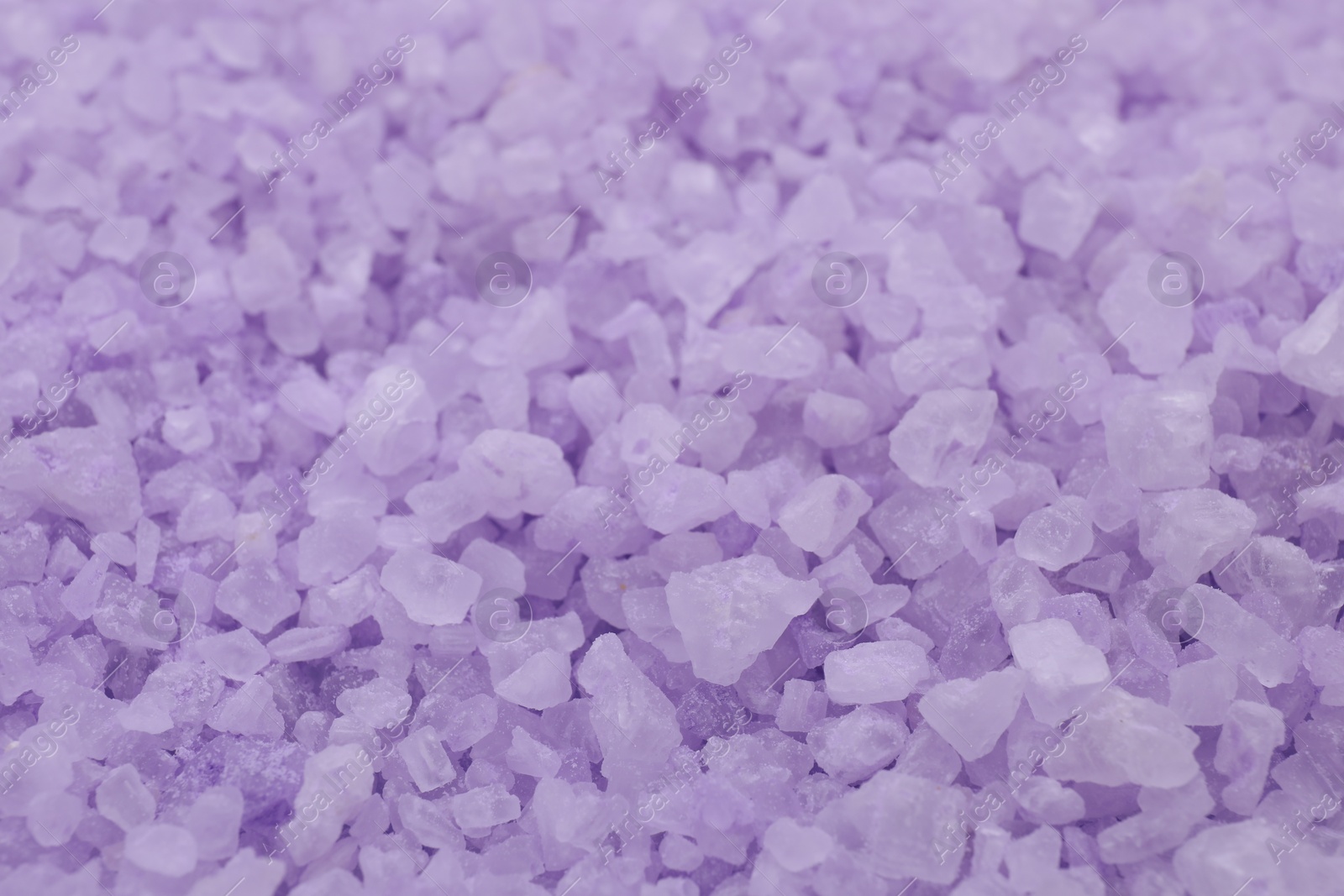 Photo of Violet sea salt as background, closeup view