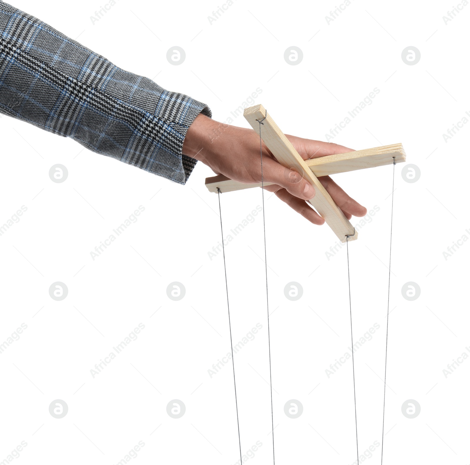 Photo of Man holding puppet control bar with strings on white background, closeup