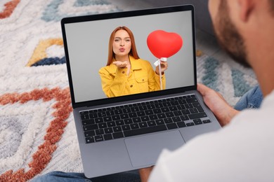 Image of Long distance love. Man having video chat with his girlfriend via laptop at home, closeup