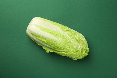 Photo of Fresh ripe Chinese cabbage on green background, top view