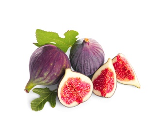 Whole and cut purple figs on white background