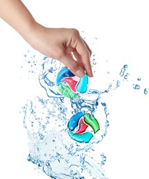 Image of Splashes of water and woman holding laundry capsule on white background, closeup. Detergent pods