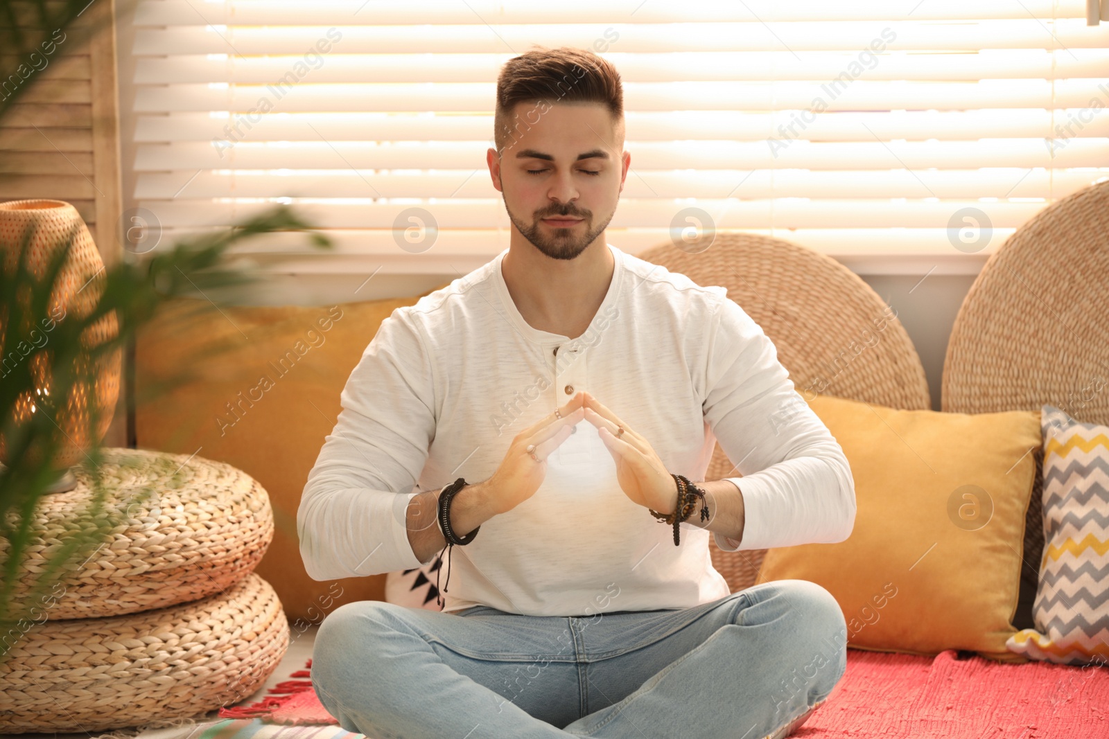 Photo of Young man during self-healing session in therapy room