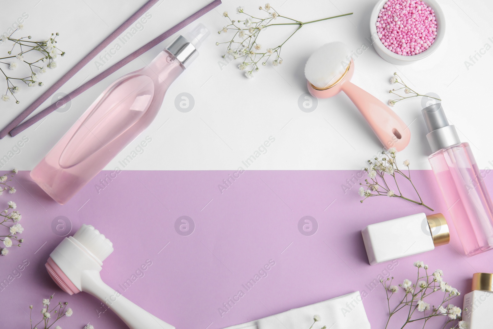 Photo of Flat lay composition with face cleansing brushes on color background. Cosmetic accessories