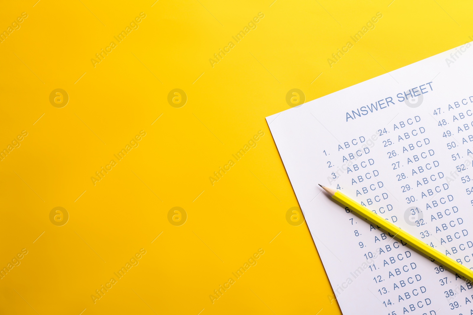 Photo of Answer sheet and pencil on color background, top view with space for text