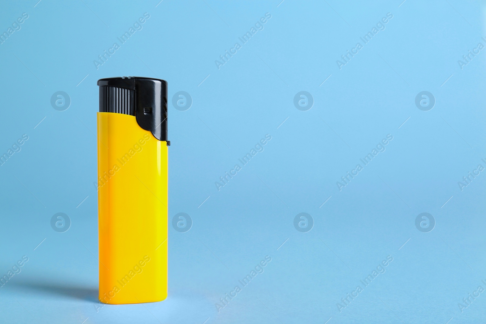 Photo of Stylish small pocket lighter on white background, space for text