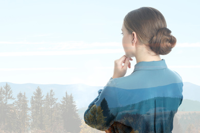 Double exposure of beautiful woman and mountain landscape