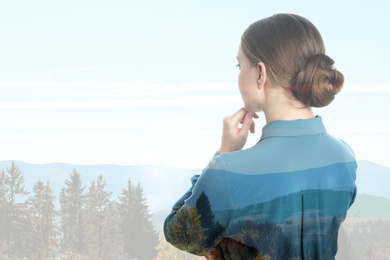 Image of Double exposure of beautiful woman and mountain landscape