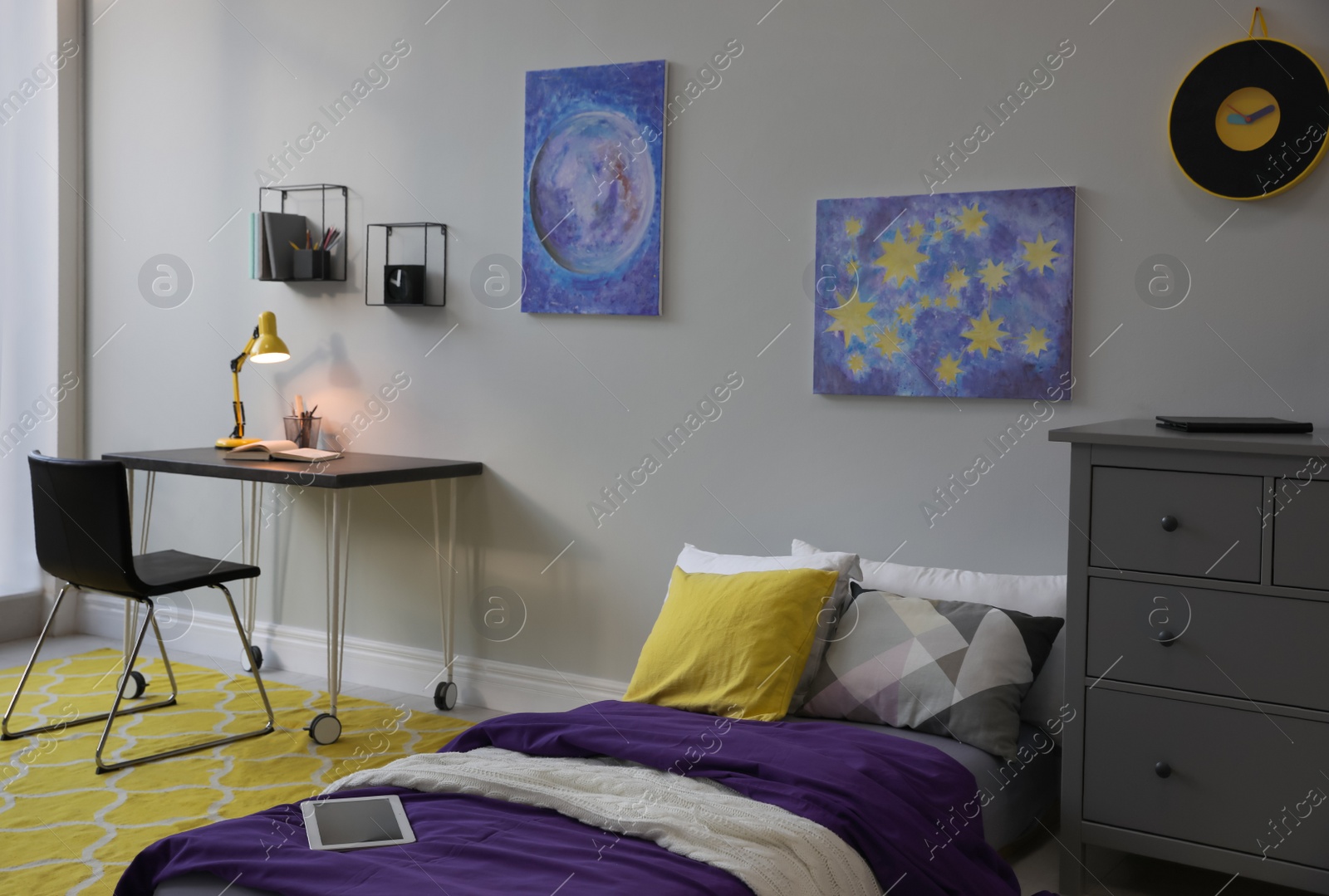 Photo of Modern teenager's room interior with comfortable bed, workplace and stylish design elements